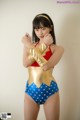 A woman in a Wonder Woman costume posing for a picture.