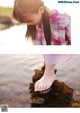 A little girl standing on a rock in the water.